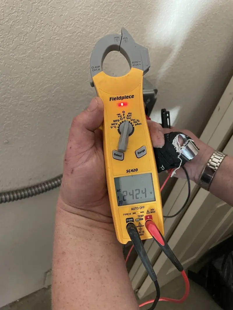 Voltage testing with clamp meter during Ceiling Fan Installation in Grand Island